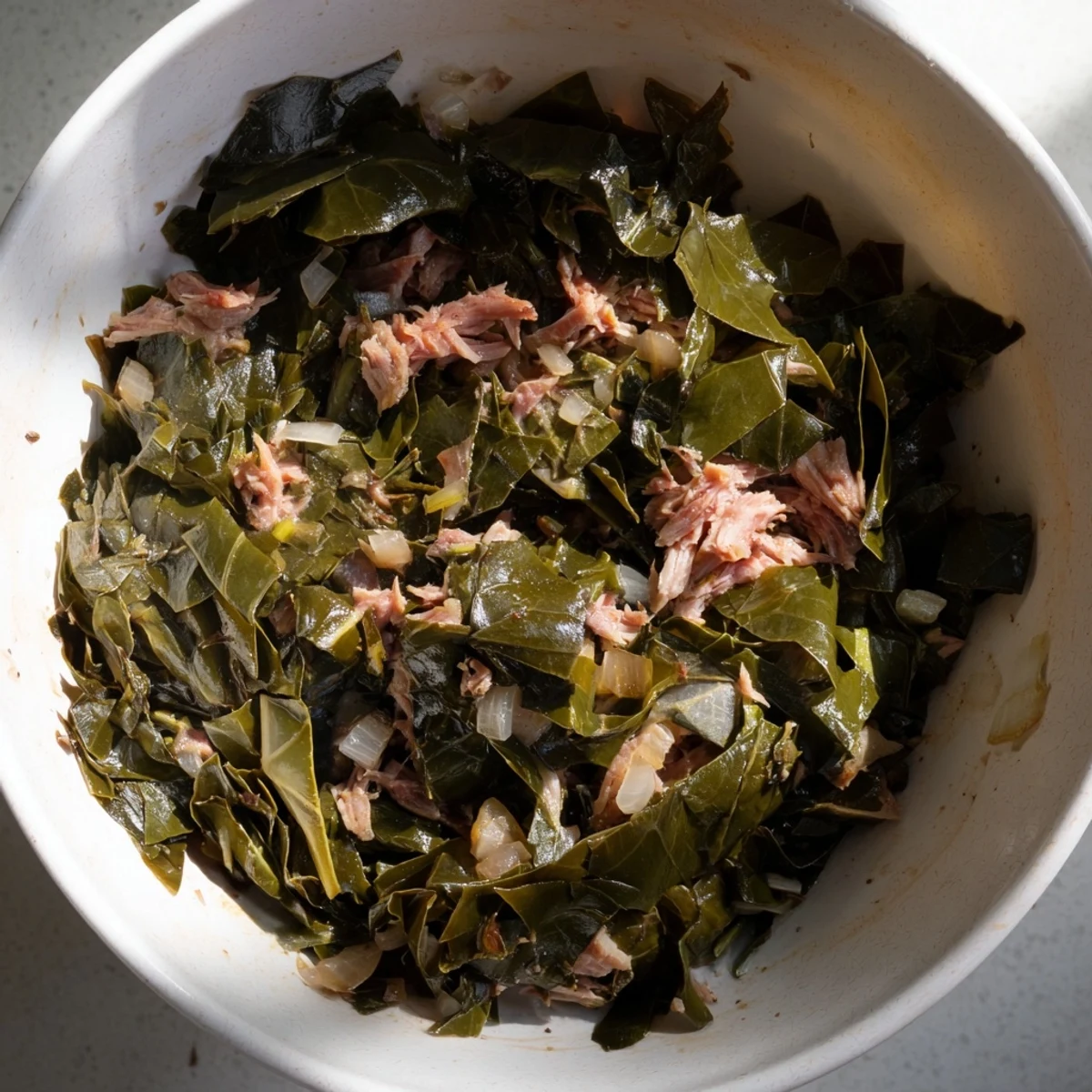 Steaming Southern Collard Greens with Smoked Turkey in a savory pot, served with a ladle of rich broth.