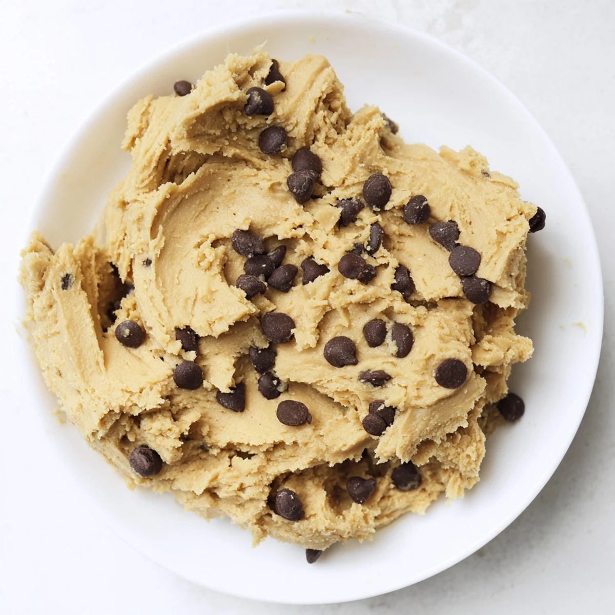 Creamy keto cookie dough with sugar-free chocolate chips ready to enjoy