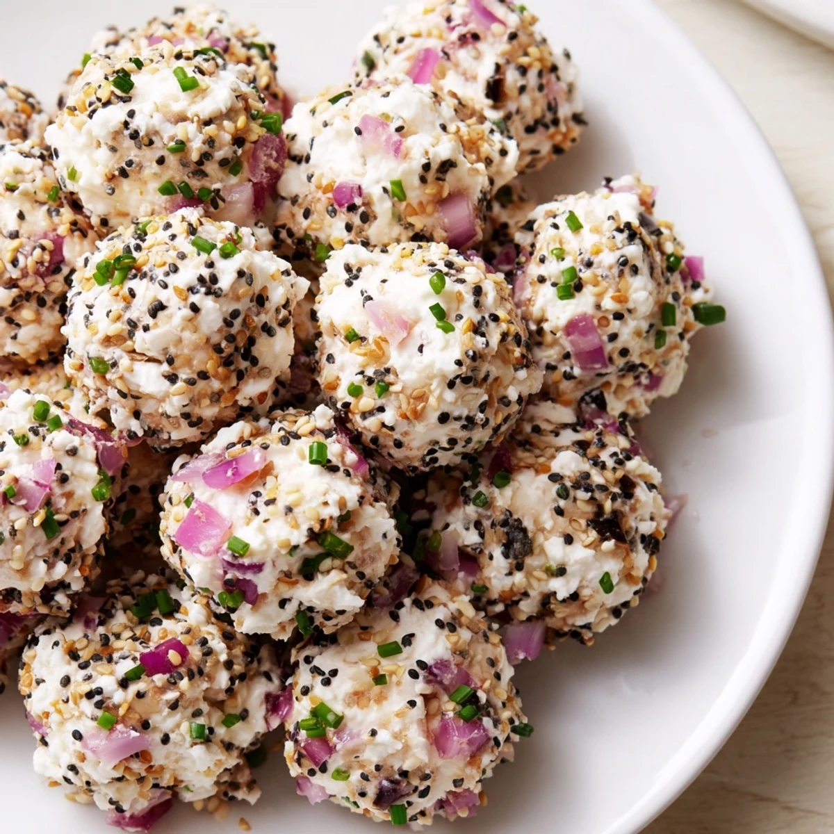 Ready-to-eat Everything Bagel Cottage Cheese Bites, showing a soft texture and crunchy bagel seasoning coating.