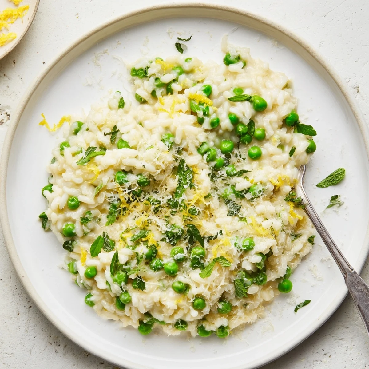 Golden Arborio rice simmered with sweet peas in a rich white wine and butter sauce