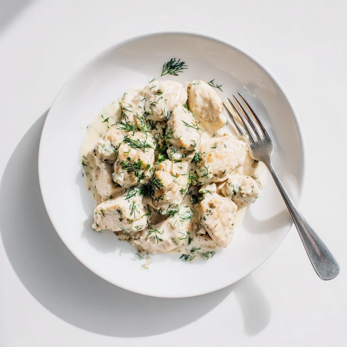 Tender chicken simmered in velvety dill cream sauce served hot for a comforting dinner