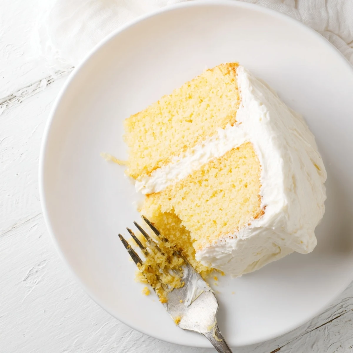 Classic American church cake slice on white plate with fork, perfect for potluck gatherings and celebrations