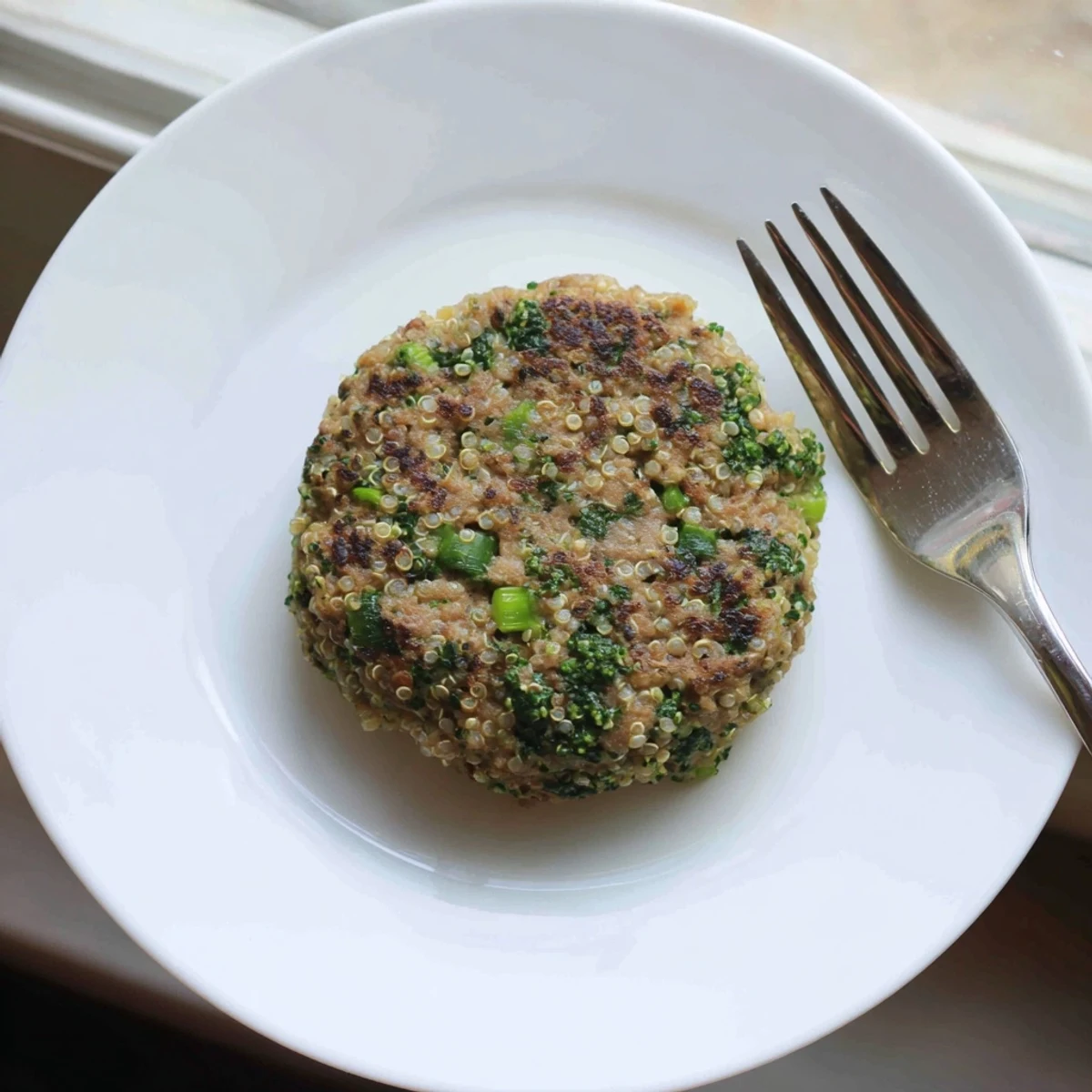 Healthy turkey burgers featuring quinoa and broccoli florets, perfectly grilled and garnished with parsley