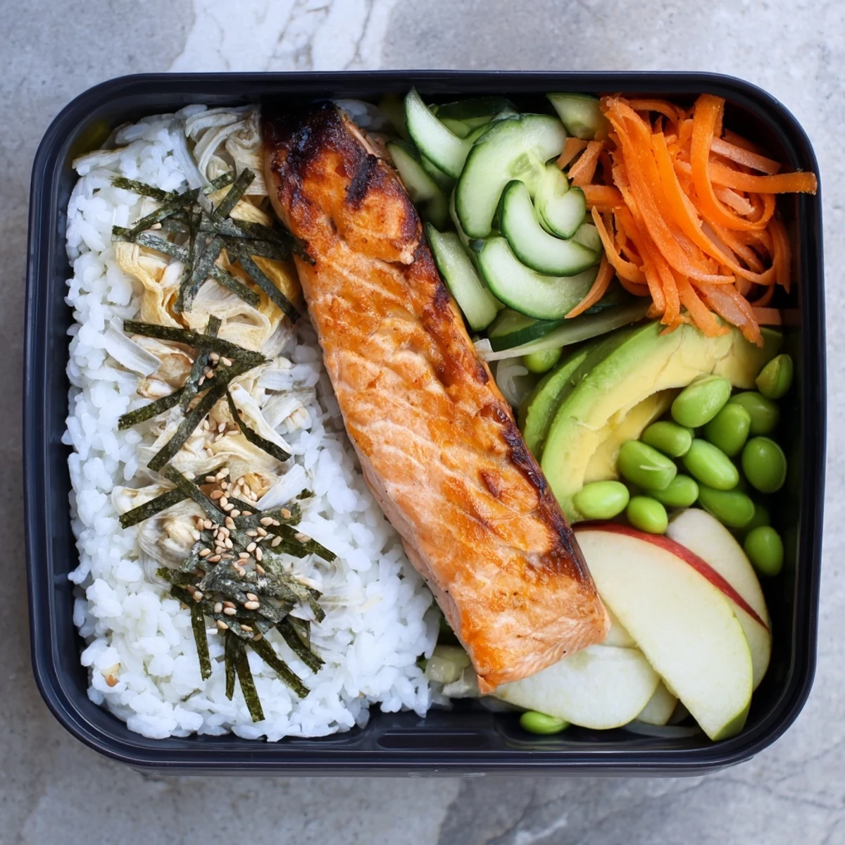 Nourishing Japanese breakfast bento with flaky fish fluffy rice tamago egg and fresh seasonal fruit ready to enjoy