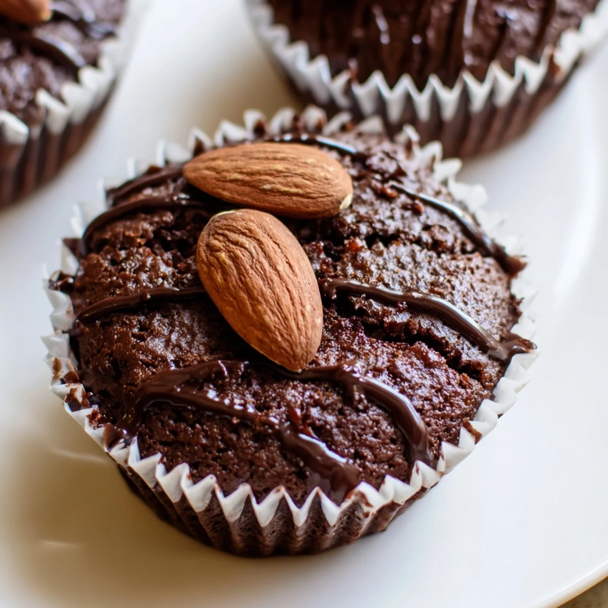 Decadent flourless almond joy cupcakes with gooey coconut centers on a rustic wire cooling rack