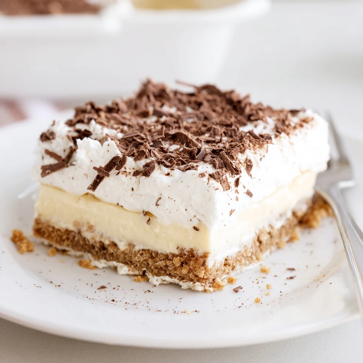 Velvety whipped cream crowns this No Bake Layered Dessert, perfect with coffee
