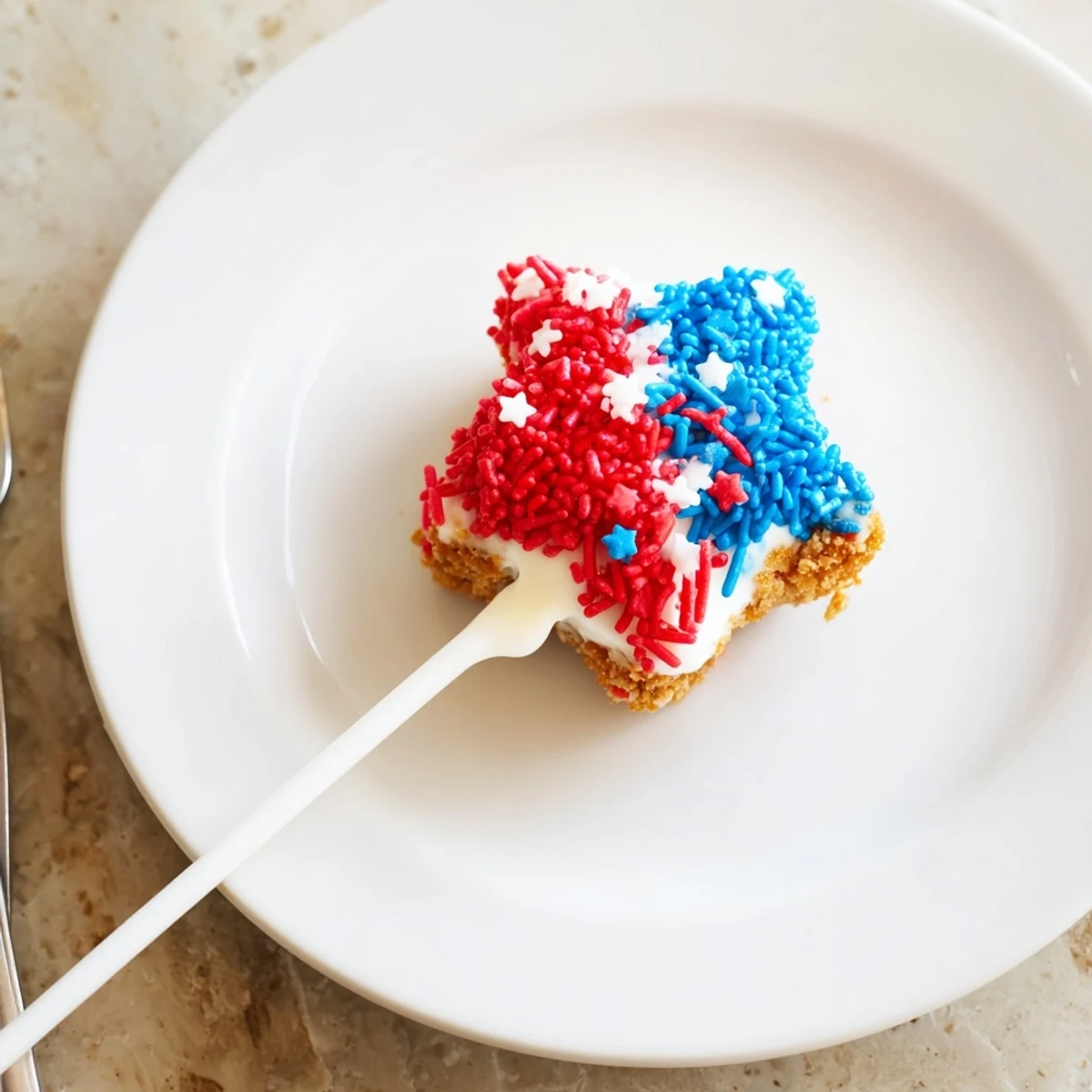 Plated Fourth Of July Star Cheesecake Pops, creamy centers with red, white, and blue