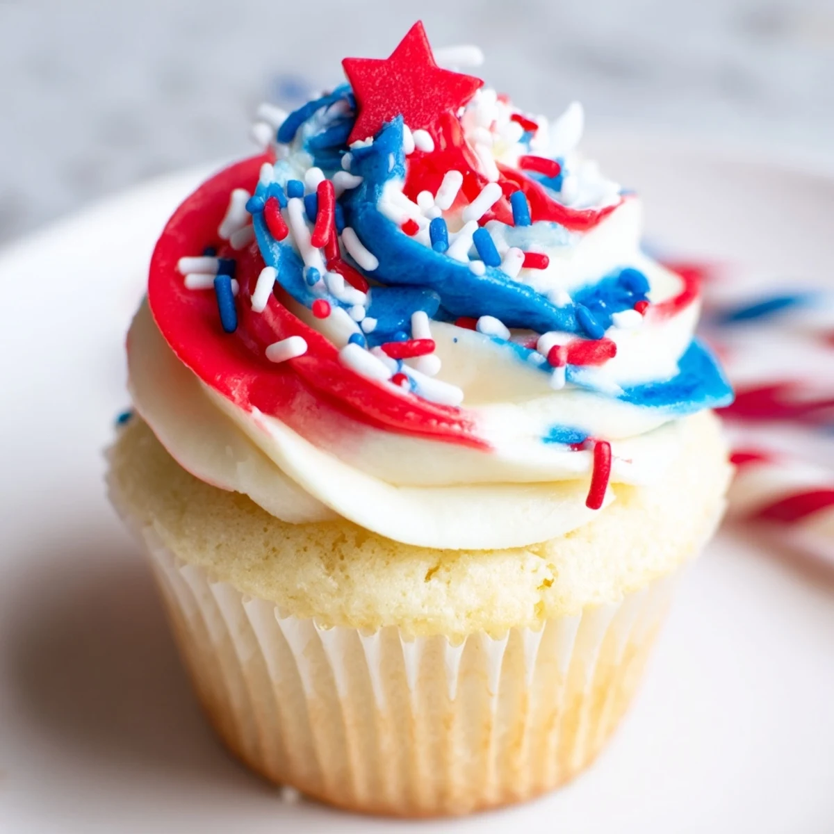 Patriotic Firework Cupcakes piped with fluffy red, white, and blue buttercream