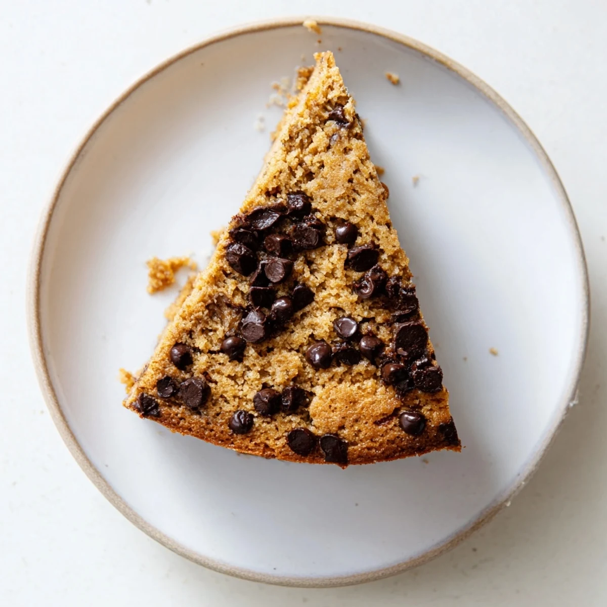 Banana Chocolate Chip Cake recipe cooling on rack, moist crumb, melted chips