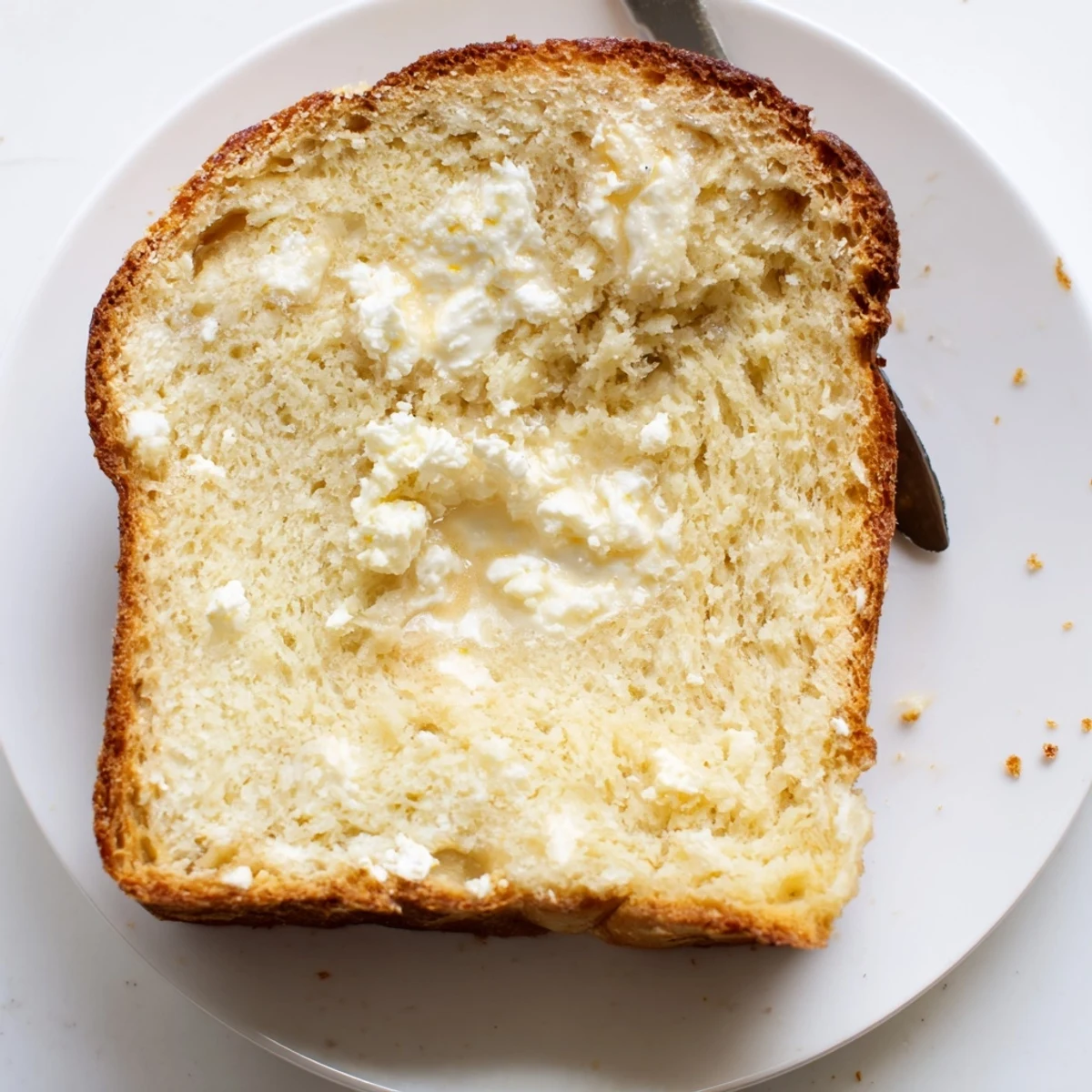 Golden Cottage Cheese Loaf Bread cooling on rack, soft crumb ready for toasting