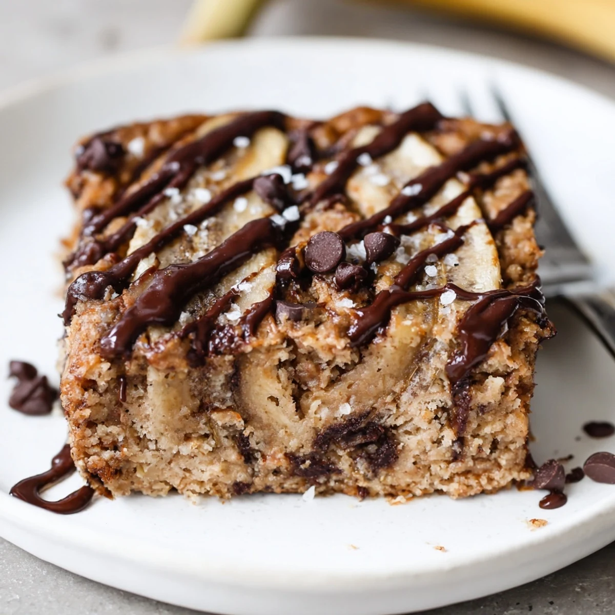 Breakfast-ready Flourless Peanut Butter Banana bars cooling on parchment, golden edges