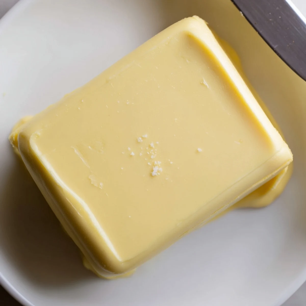 Golden Vegan Dairy Free Butter softened on plate, nutty aroma, creamy texture