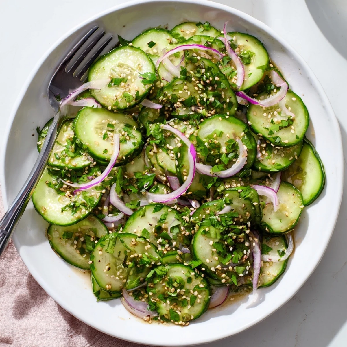 Vibrant honey lime cucumber salad featuring thinly sliced vegetables drizzled with sweet and tangy lime dressing