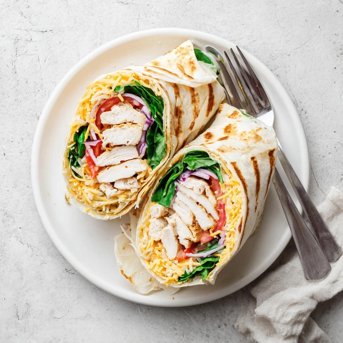 Cheesy Garlic Chicken Wraps ideal for meal prep, creamy cheese and herbs
