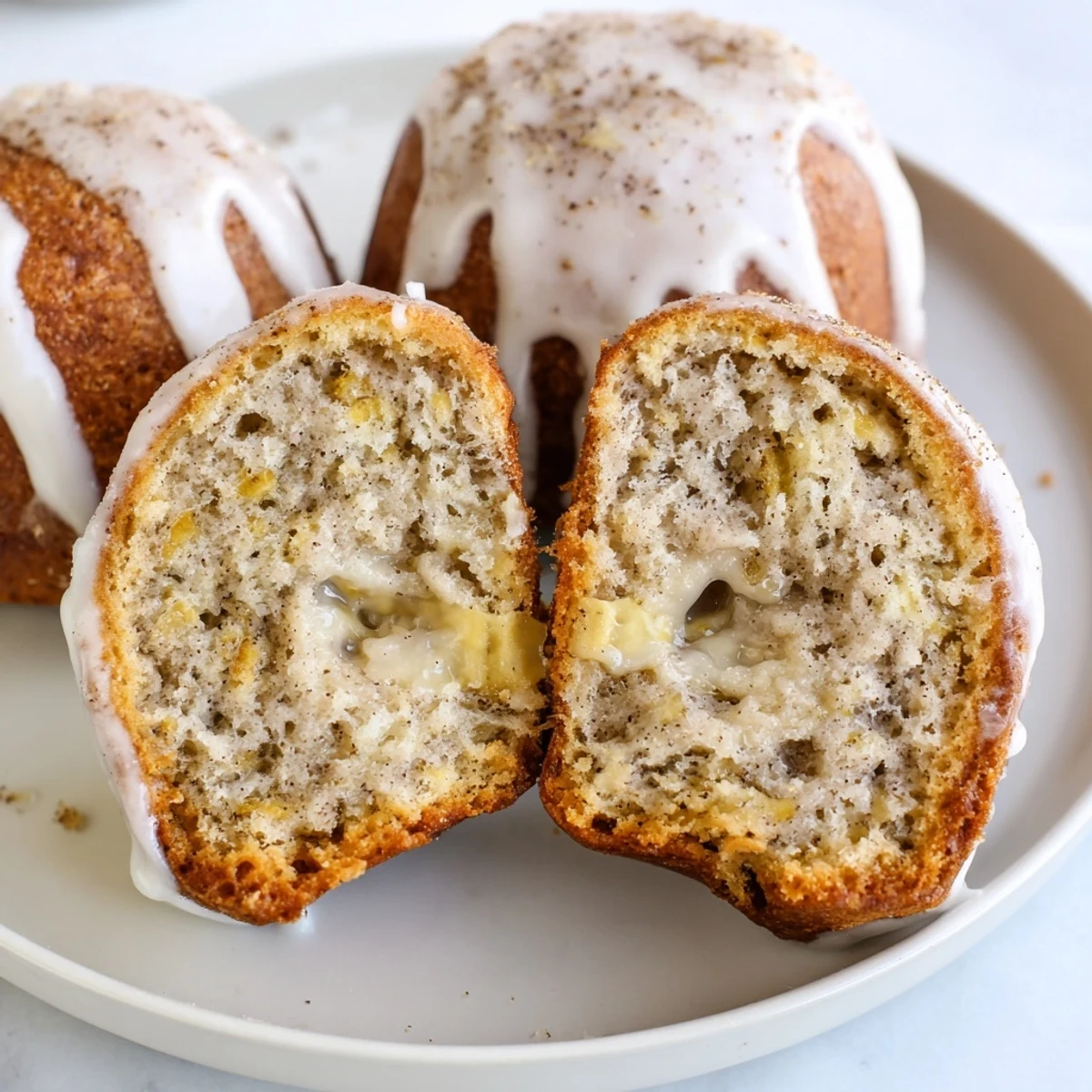 Freshly baked Banana Donuts cooling on a wire rack, tempting breakfast treat