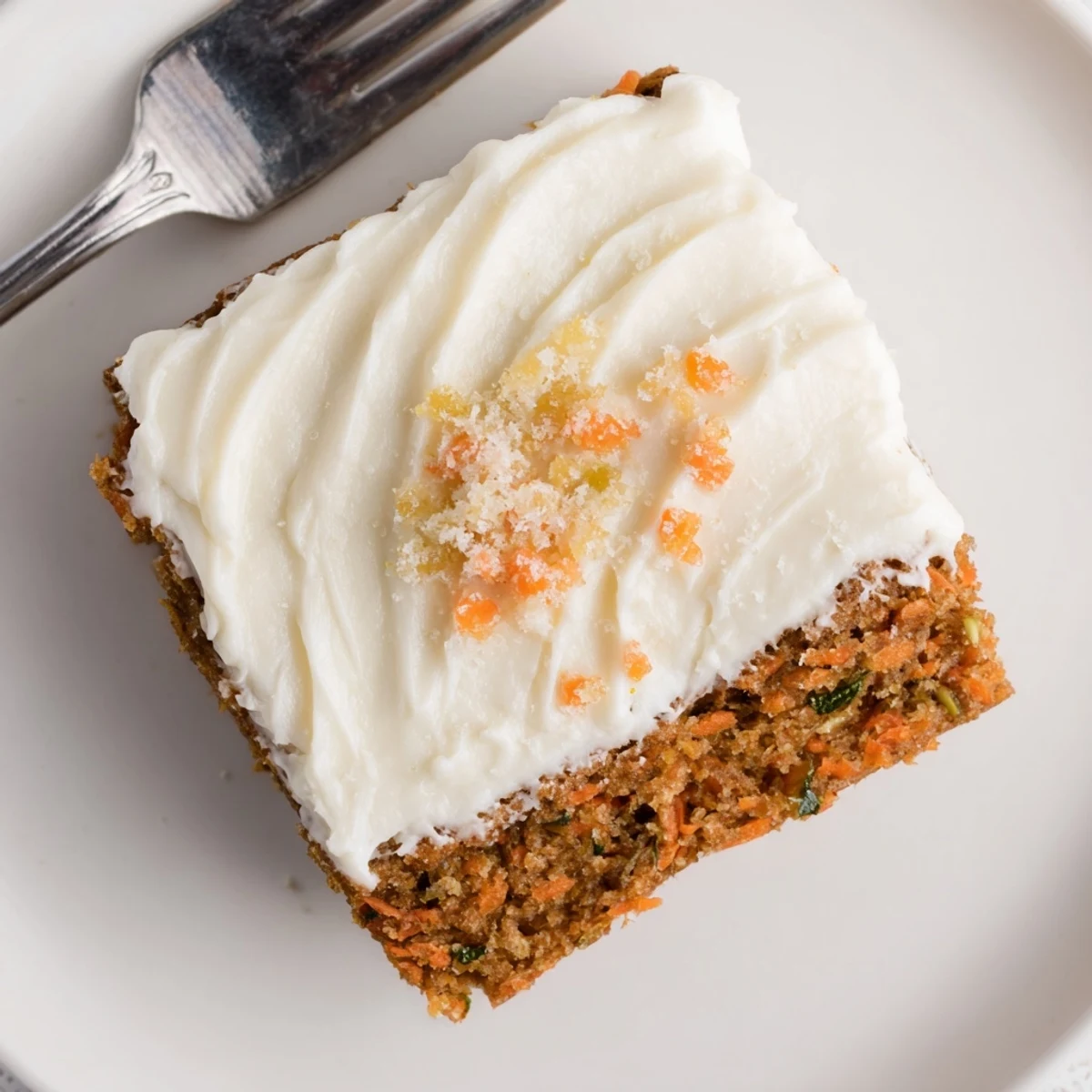 Spiced Ginger Carrot And Zucchini Bars With Lemon Cream Cheese Frosting, moist and warm.