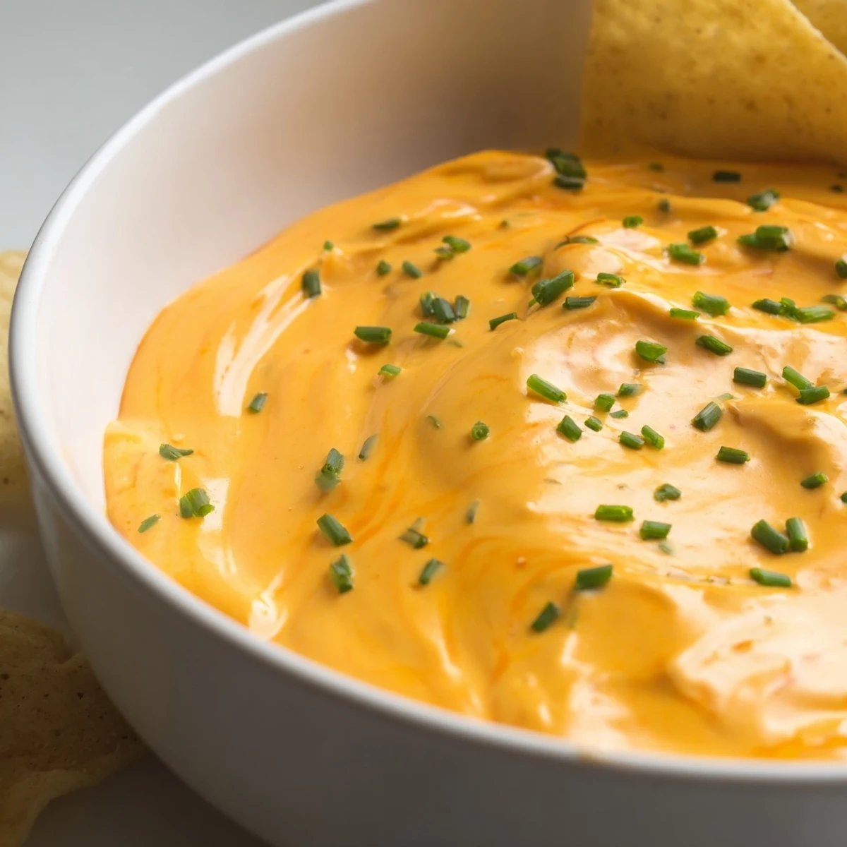 Bubbling cheese dip with smoky paprika, scooped up with crunchy breadsticks.